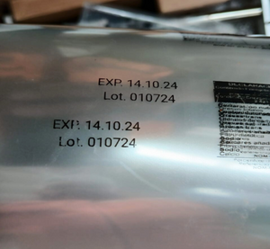 Etiqueta en tapa de botella